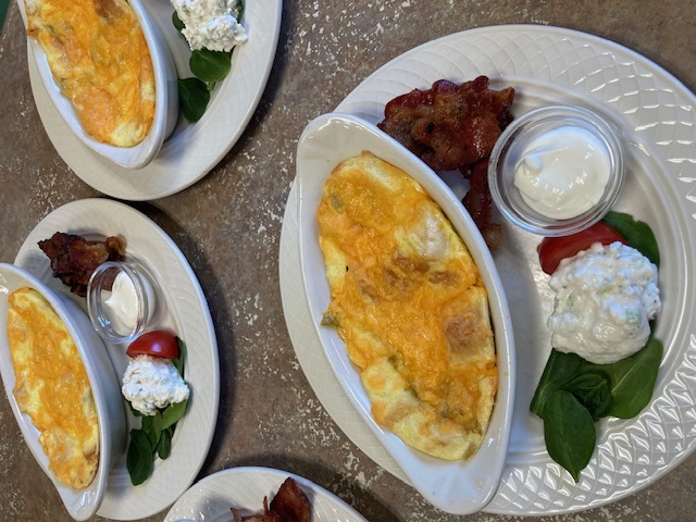 a close-up of several plates of breakfast food