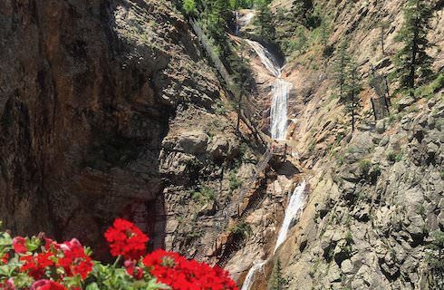 Small waterfall with seven falls coming down the side of a mountain